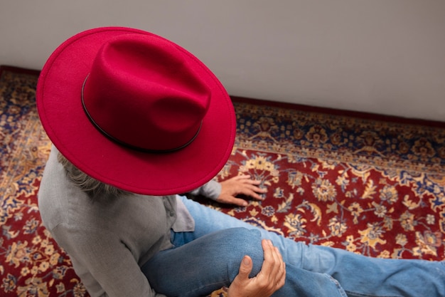 View of woman wearing stylish fedora hat