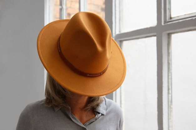 Free photo view of woman wearing stylish fedora hat