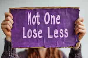 Free photo view of woman with purple message placard for womens day celebration