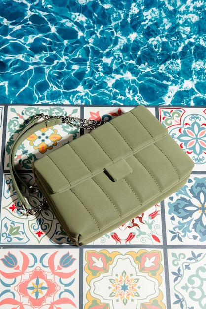 Free Photo view of women's purse over tiles with mediterranean aesthetics