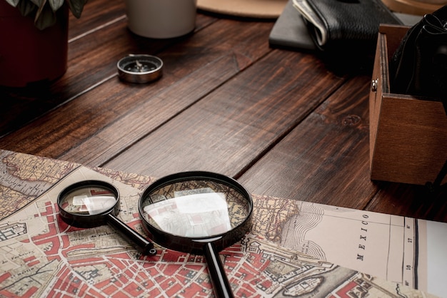 Free photo view of world travel map with magnifying glass