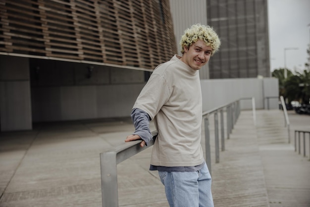 Free photo view of young man smiling at camera