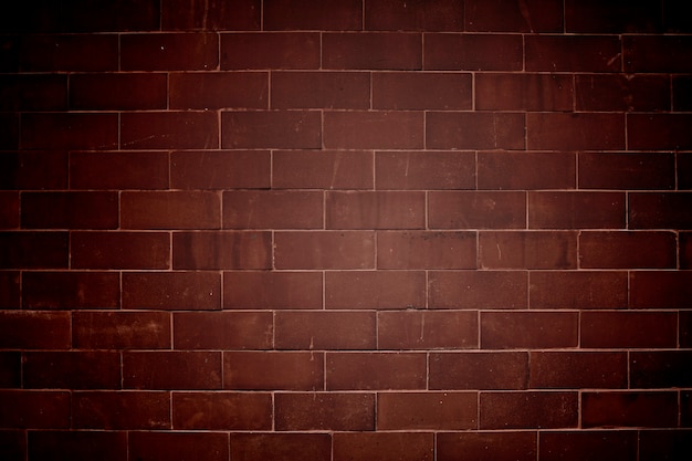 Vignette brownish-red brick wall textured background