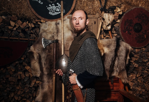 Viking posing against the ancient interior of the Vikings.