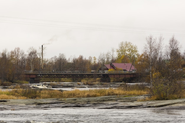 Village at the shore of the White Sea on cloudy weather in autumn