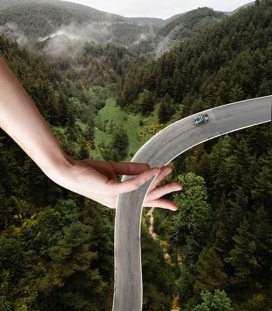 Vintage collage with hand holding road