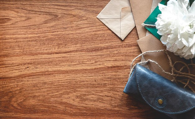 Vintage composition with envelopes on wooden background flat lay