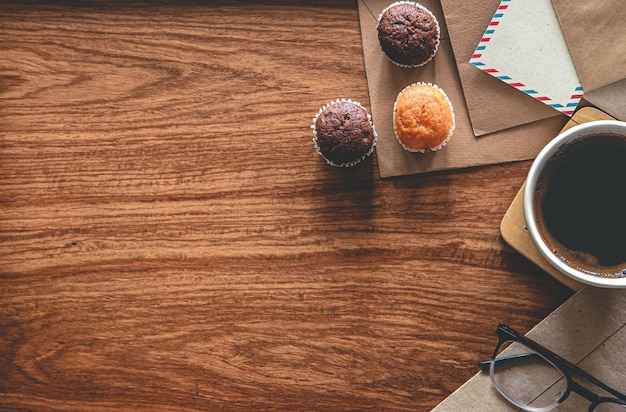 Vintage composition with envelopes on wooden background flat lay