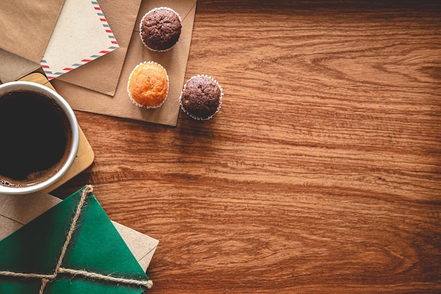 Vintage composition with envelopes on wooden background flat lay