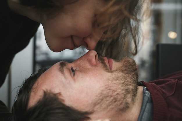 Vintage couple . Girl kiss her boyfriend from above