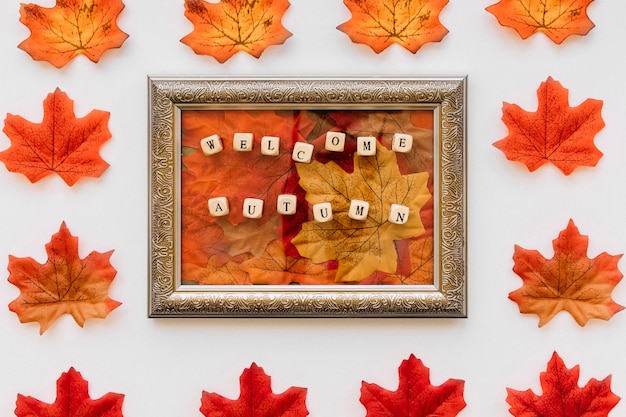 Vintage frame with autumn leaves concept