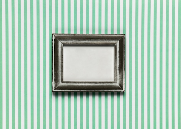 Free photo vintage frame with striped background