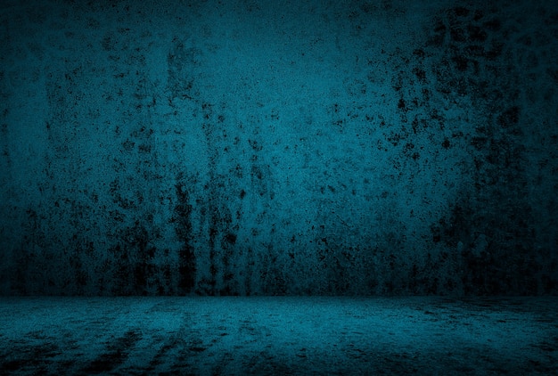 Free photo vintage grunge blue concrete texture studio wall background with vignette.