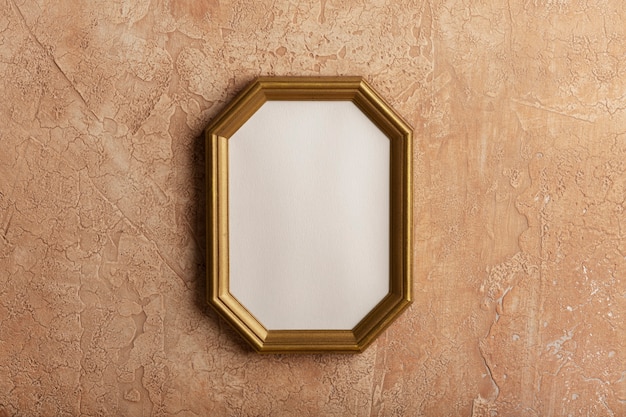 Free photo vintage hexagonal frame on wall