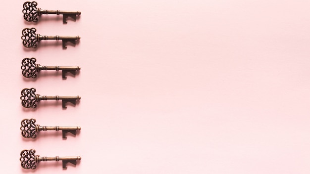 Vintage Keys Pattern On pink Background