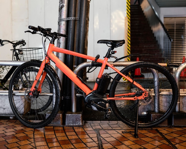 Free photo vintage orange bicycle with black details