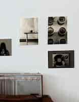 Free photo vintage radio and vintage photograph posters on the wall