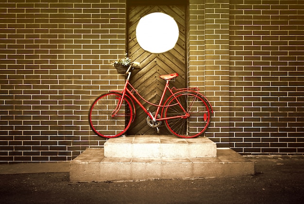 Free photo vintage retro old yellow bike on the street.