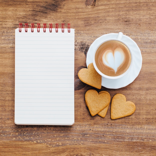 Free photo vintage school notebook with breakfast and coffee.