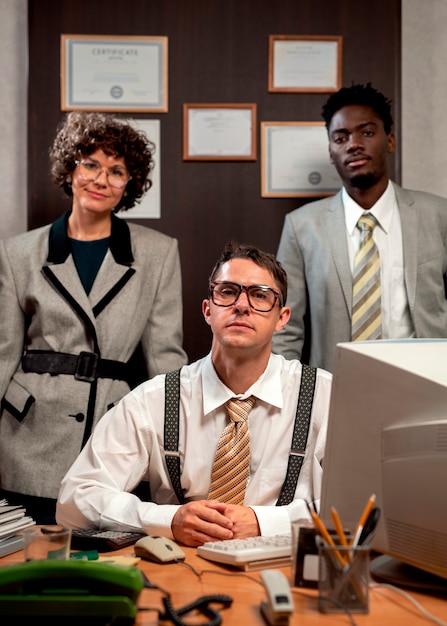 Free photo vintage style office workers having a desk job