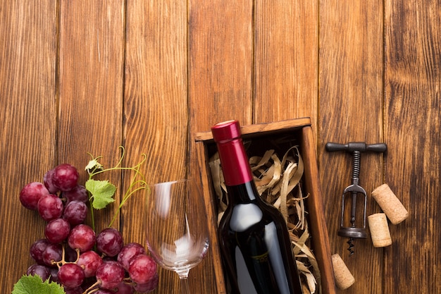 Vintage wooden table with red wine