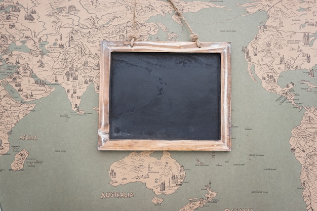 Free Photo vintage world map background with slate