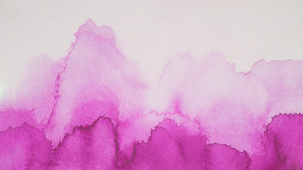 Violet blots of paints on white paper