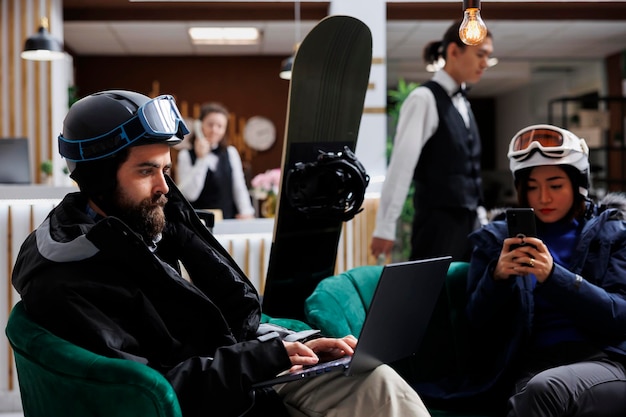 Free Photo visitors sit comfortably with devices