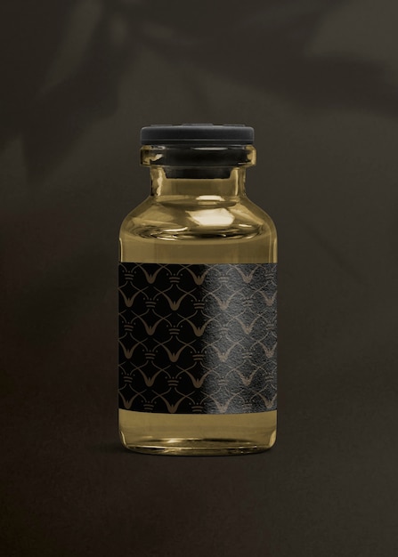 Free Photo vitamin injection glass bottle with luxurious black label for health and wellness product packaging