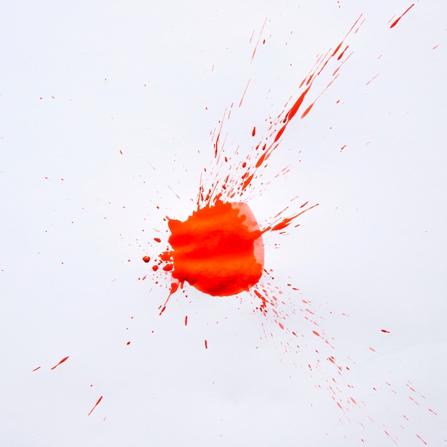 Free photo vivid red paint stain on white