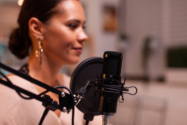 Vlogger woman recording video for her blog in home studio