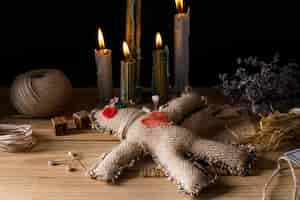 Free photo vodoo doll and candles arrangement