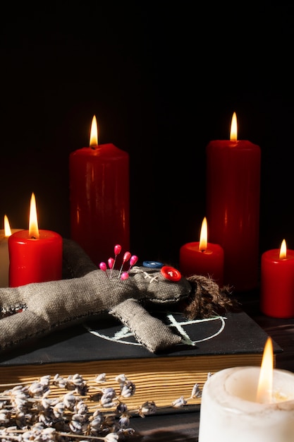 Free photo vodoo doll and candles arrangement