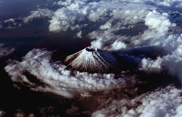 Volcanic Mount Fuji covered with clouds in Japan