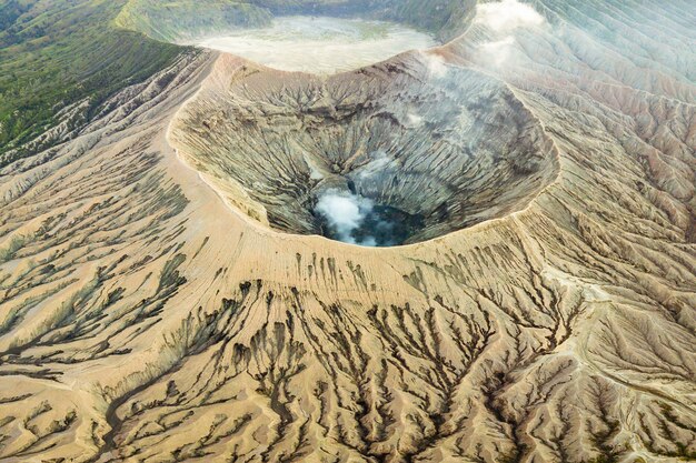 Volcano crater expelling smoke