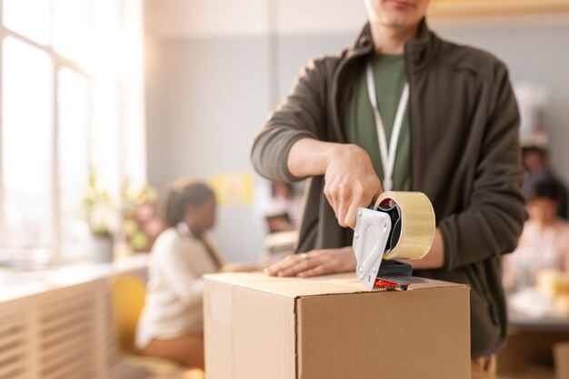 Volunteer helping with donation box