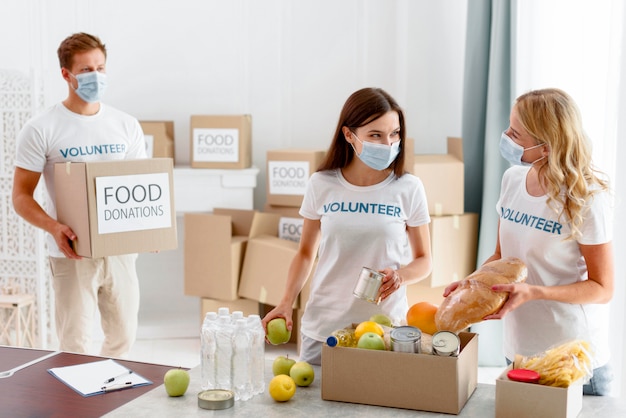 Volunteer helping with food for donation