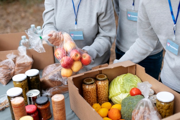 Volunteers collecting food donations close up