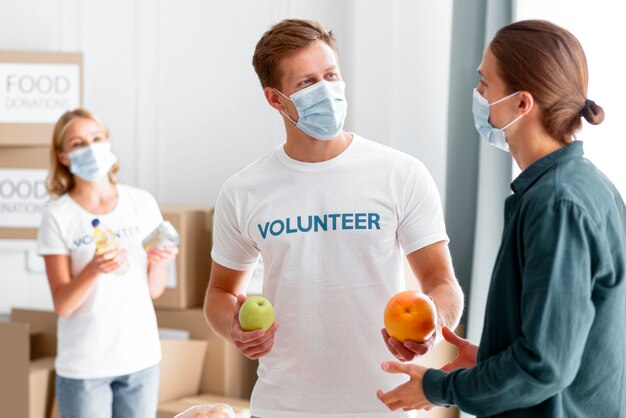 Volunteers helping and packing food for donation