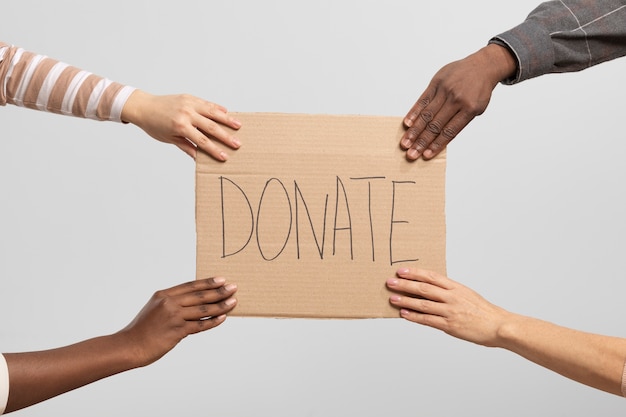 Free Photo volunteers holding a box containing donations for charity