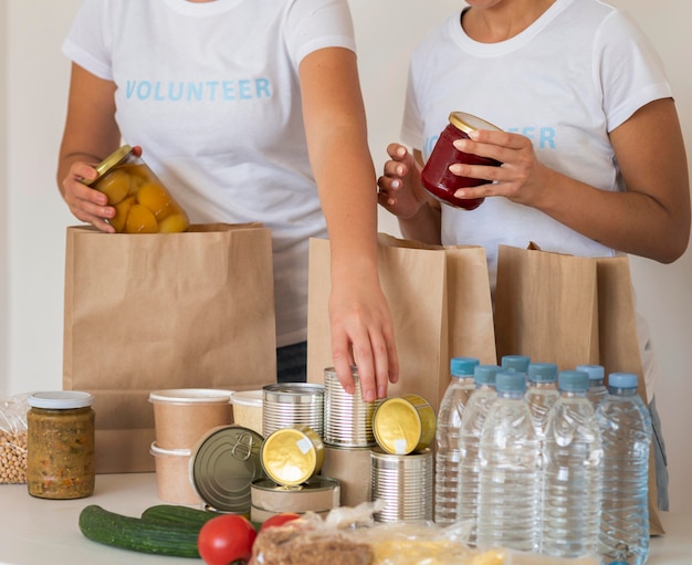 Volunteers with bags and water for donation