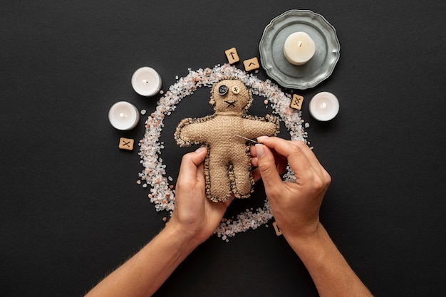 Free Photo voodoo doll and esoteric items on dark background