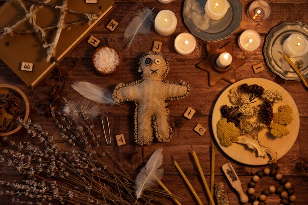 Voodoo doll and esoteric items flat lay