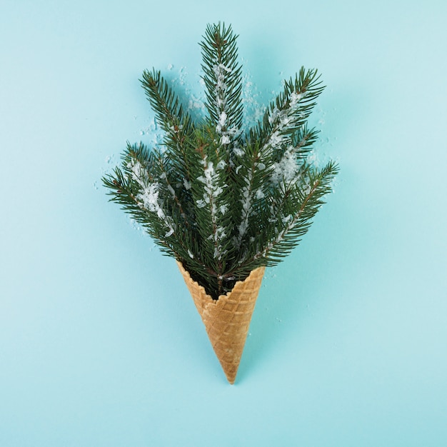 Free photo wafer cup with fir twig and ornament snow