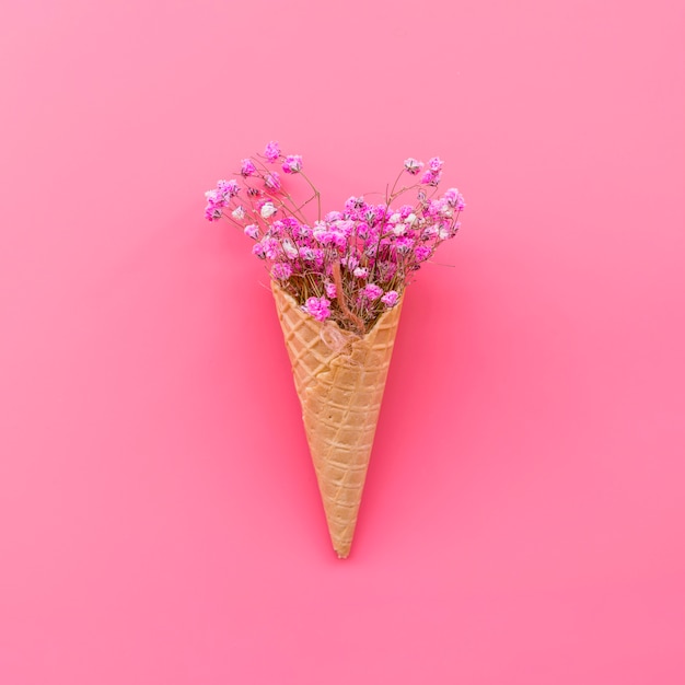 Free Photo waffle cone with pink flowers