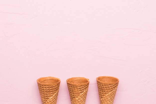 Free photo waffle cones on pink background