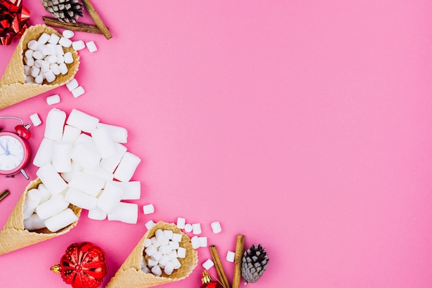 Free Photo waffle cones with christmas toys on table 