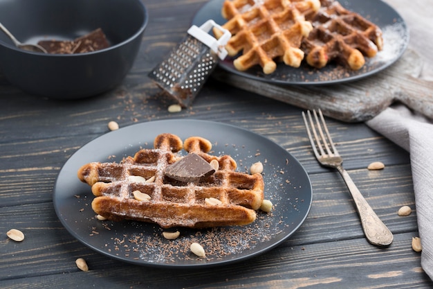 Waffles with chocolate on plates