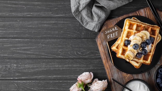 Waffles with fruits assortment flat lay