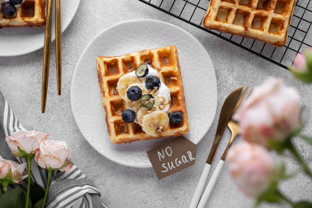 Free photo waffles with fruits assortment top view